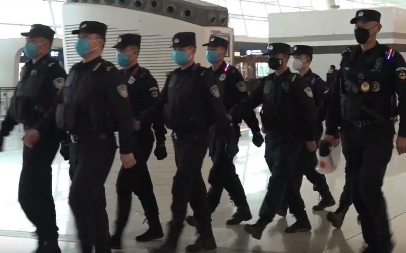 Policemen_wearing_masks_patrolling_Wuhan_Tianhe_Airport_during_Wuhan_coronavirus_outbreak